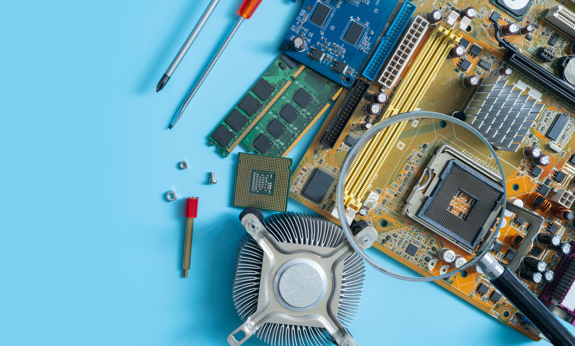 Computer chip and magnifying glass. Chipset on electronic circuit board of PC motherboard at repair